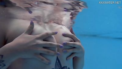 lovely ash-blonde Finnish porn industry star Mimi Cica underwater