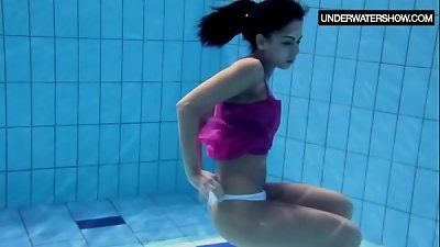 Zlata Oduvanchik swims in a pink top and undresses