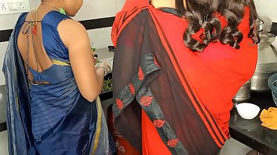 Komal and her mother-in-law were both working in the kitchen.