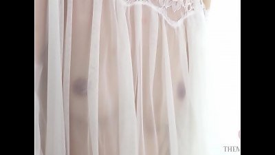 seduces in nipple-skimming horny garb